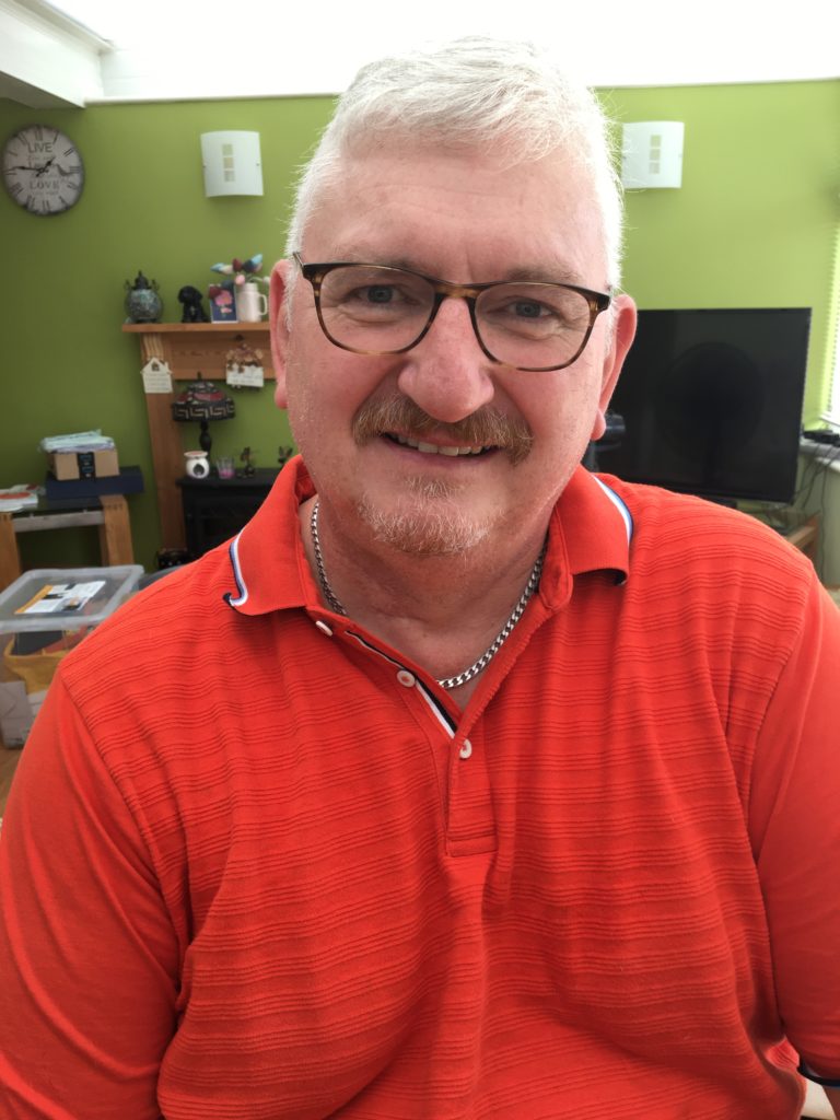 Mr. Hodgson fitted with his hearing aids