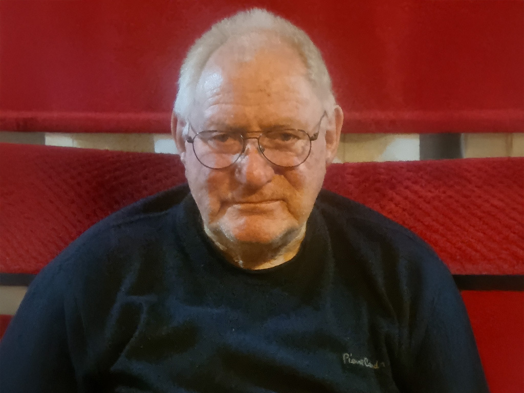 Portrait of Mr Brain Sands after his better hearing aid fitting.