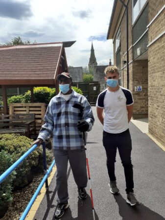 Resident and staff member at Rainbow Court